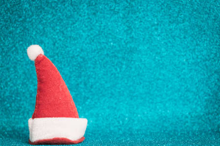 Santa Claus red hat on sparkling background.  Christmas seasons celebration conceptの写真素材