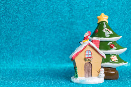 House and Pine tree on sparkling background.  Christmas seasons celebration conceptの写真素材