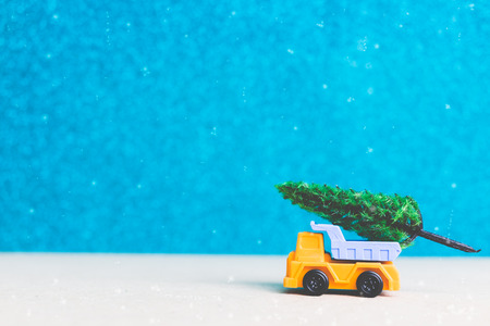 Christmas tree on miniature car. Christmas seasons celebration conceptの写真素材