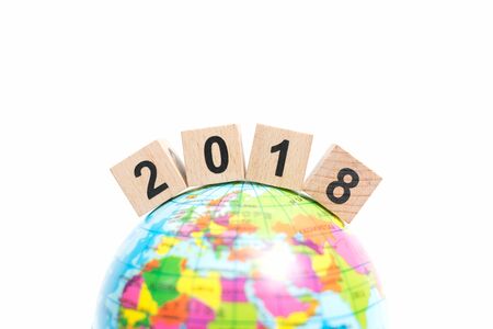 Wooden block number 2018 on globe map , New year conceptの写真素材