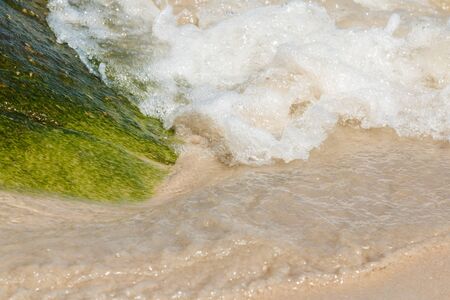 Soft wave of ocean on The beach background.