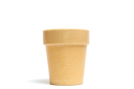 Recycled materials biodegradable tree pot isolated on a white backgroundの写真素材