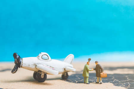 Miniature people : Travellers with airplane on The world map , Travel and business concept.の写真素材