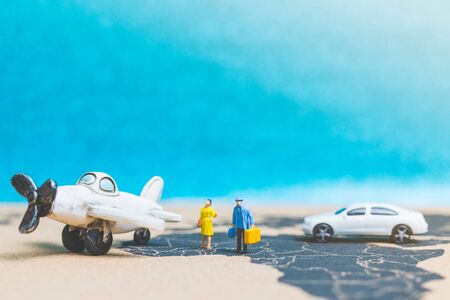 Miniature people : Travellers with airplane on The world map , Travel and business concept.の写真素材