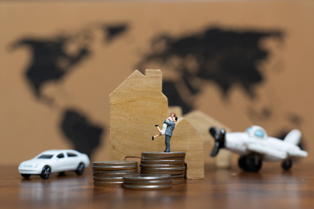 Miniature people : Luxury Lifestyle Couple with a lot of money , car, house and airplane, successful conceptの写真素材