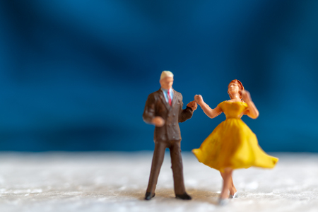 Miniature people , Couple dancing on the floor  , Valentine's day conceptの写真素材