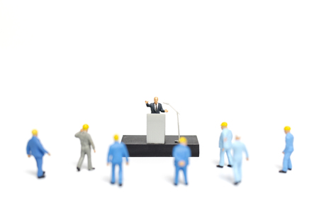 Miniature people : A politician speaking to the people during an election rallyの写真素材