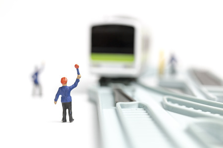 Miniature people : Railway staff are working at railway  on white backgroundの写真素材