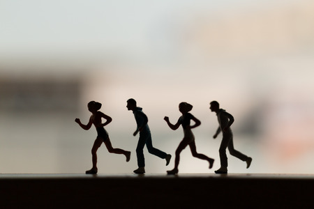 Miniature people is Running , Silhouette of a runner , Health And lifestyle concepts.の写真素材
