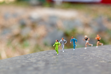 Miniature people Running on The Rock , Health And lifestyle concepts.の写真素材