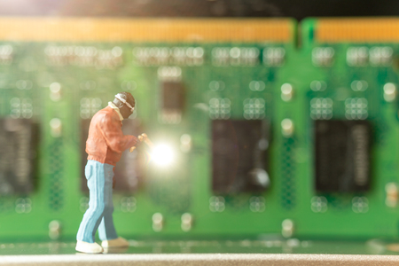Miniature people : Computer repairman repair Computer hardware , Technology conceptの写真素材