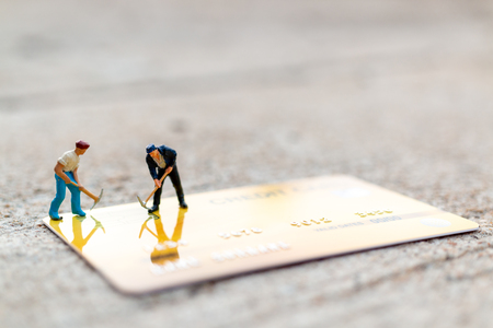 Miniature people : Worker are working on Credit card, Business and Finance conceptsの写真素材