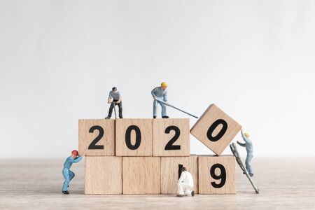 Miniature worker team create number 2020 and remove number 2019  , Happy new year 2019 conceptの写真素材