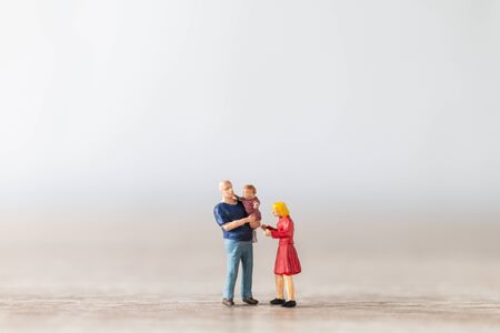 Miniature people : Parents with children walking outdoor , Happy family conceptの写真素材