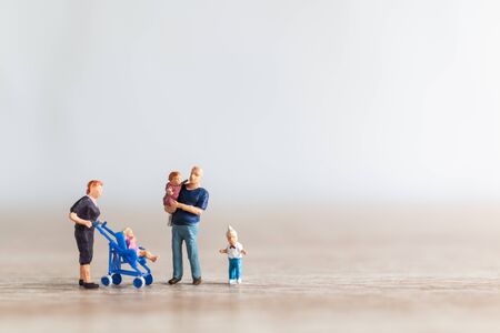 Miniature people : Parents with children walking outdoor , Happy family conceptの写真素材