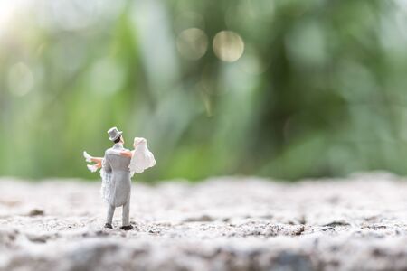 Miniature people : Bride and groom couple standing outdoor  , Happy valentine's day conceptの写真素材