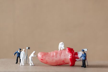 Miniature people :  Police officers use Fake finger for Halloween Party Props Decorations.の写真素材