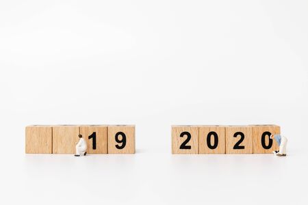 Miniature people : Worker team create wooden block number 2020  , Happy new year conceptの写真素材