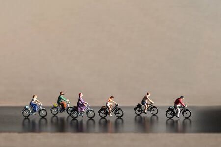 Miniature people : Travelers riding bicycle , Healthy lifestyle conceptの写真素材