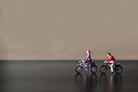 Miniature people : Travelers riding bicycle , Healthy lifestyle concept