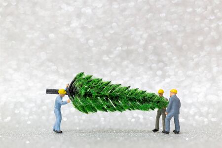 Miniature people : Worker team prepare christmas tree , Christmas decoration concept