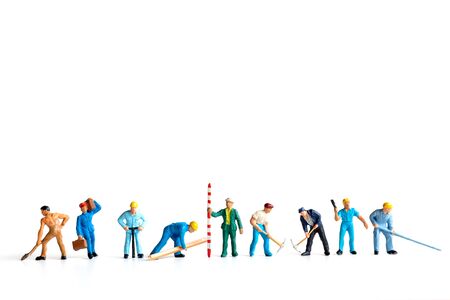 Miniature people ,worker team standing on white background and copy space for your text , Labour day conceptの写真素材