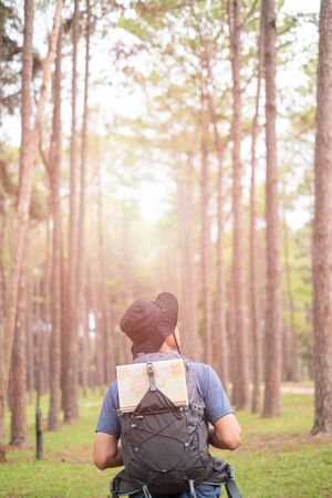 Asian man with backpack hiking in forest , Adventure Travel Remote Relax Conceptの写真素材