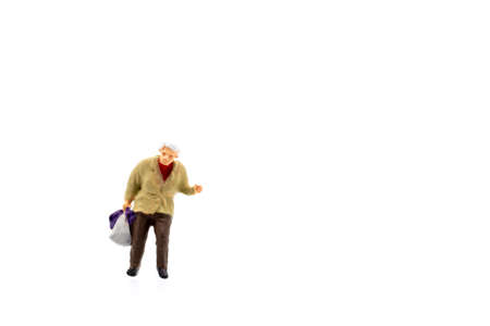 Miniature people standing on white background and space for textの写真素材