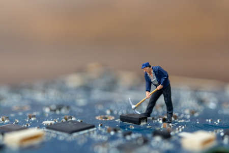 Miniature people working on cpu board, Technology conceptの写真素材