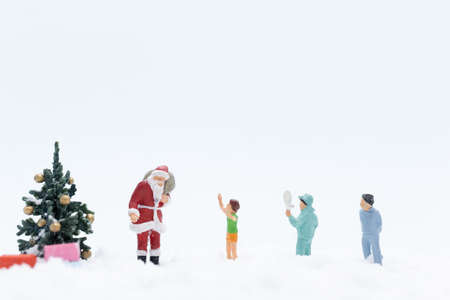 Miniature people, Santa claus and gifts for kid , Christmas and Happy New Year concept.の写真素材