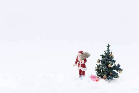 Miniature people, Santa claus and gifts for kid , Christmas and Happy New Year concept.の写真素材