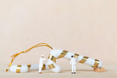 Miniature people,  Worker team working with a Christmas decoration , Christmas and Happy New Year...