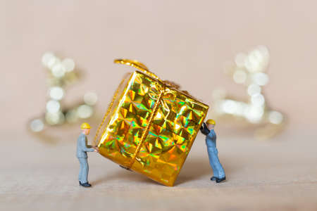 Miniature people,  Worker team working with a Christmas decoration , Christmas and Happy New Year concept.の写真素材