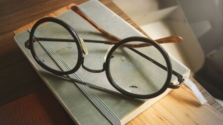 Vintage Eyeglasses on NoteBook, Empty Space.