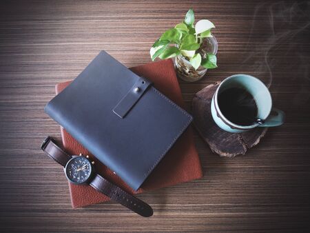 Stationary With Coffee Cup on Wooden Table, Working Concept.の写真素材