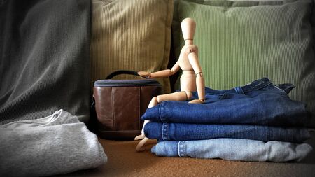 Wooden Human With Man Casual Outfits with Man Blue Jeans Clothing and Accessories on Background, Travel Concept, Decoration, Front View,の写真素材