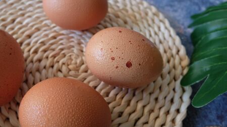 Fresh Egg in Wicker Basket on Table, Egg ingredients Cooking, Egg Easy Cooking Menu Concept,...