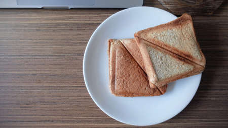 Top View Bun on White Dish on Wooden Table,の写真素材