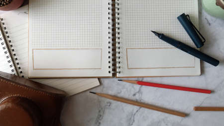 Top View Book With Stationary on Table, Pen With Blank Book on Table, Working or Thinking Concept,...