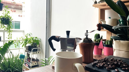 Coffee beans and coffee maker on wooden table in coffee shopの写真素材