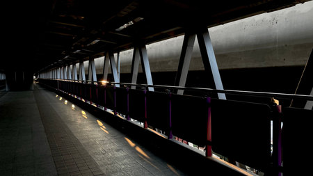 Abstract image of a metal bridge in the city at night with lightsの写真素材