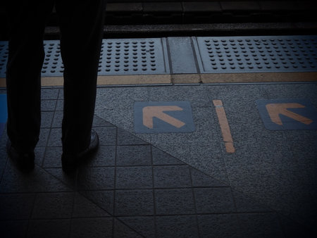 Businessman walking on the street in the evening. Shallow depth of field.