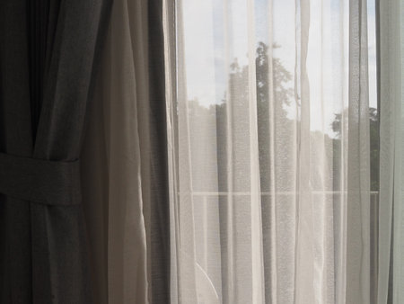 white curtain and blue sky in the morning, can be used as backgroundの写真素材