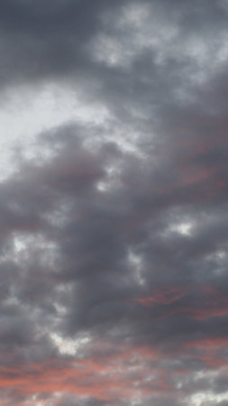 Cloudscape, Colored Clouds at Sunset near the Ocean as a Backgroundの写真素材