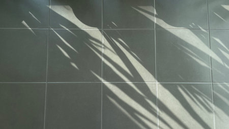 Tiled floor with shadow of palm tree leaves. Shadow of palm leaves.の写真素材