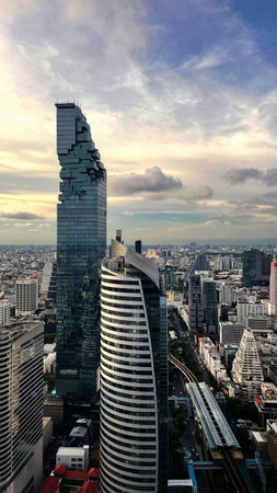 Aerial view of Bangkok cityscape with skyscrapers at sunset