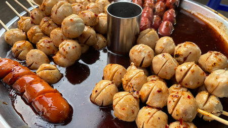 Meatballs on skewers in a street food market, close-upの写真素材