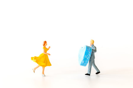 Miniature people , Man giving to his woman a big heart ,valentines day conceptの写真素材