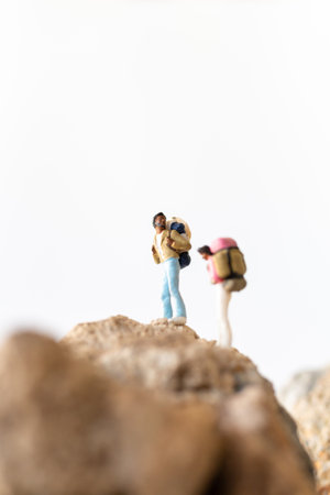 Miniature people , Hikers with backpacks standing on top of a mountain , Adventures conceptの写真素材