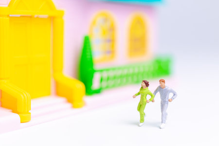 Miniature people , Couple running near their house together , Healthy lifestyle concept
